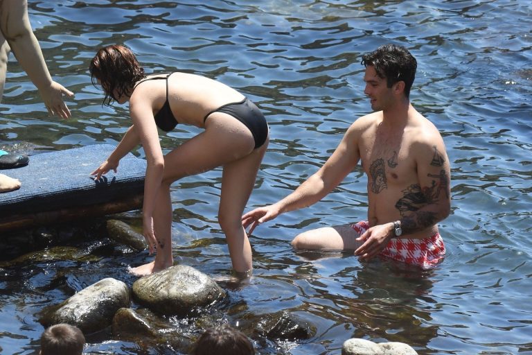 Zoey Deutch Bikini Pictures Zoey Deutch sexy boobs and ass in a little bikini in the water seen by paparazzi.