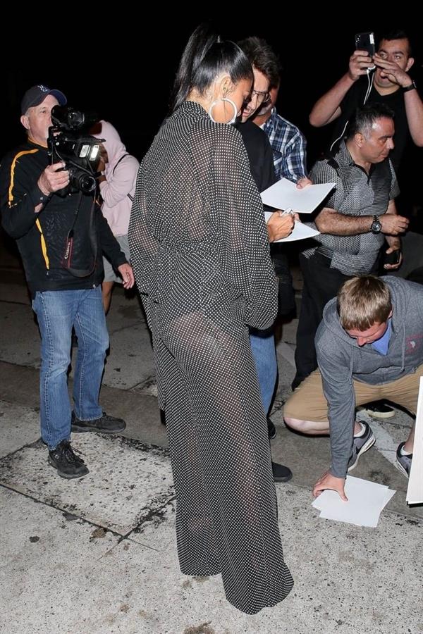 Nicole Scherzinger sexy in a see through outfit showing her braless boobs and ass seen by paparazzi.
