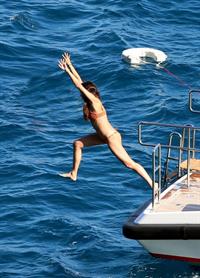 Sara Sampaio sexy ass and cleavage in a thong bikini seen by paparazzi.

