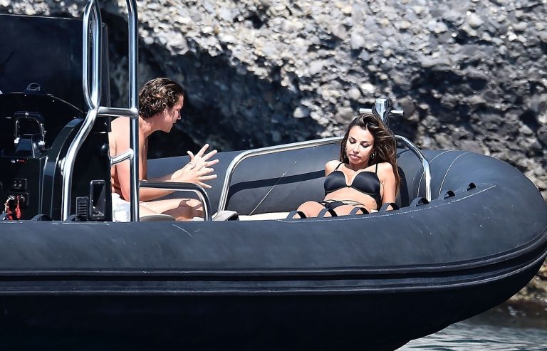 Madalina Diana Ghenea sexy ass and cleavage in a thong bikini seen by paparazzi.


