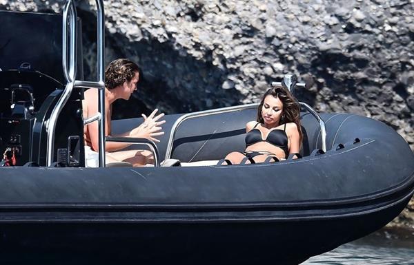 Madalina Diana Ghenea sexy ass and cleavage in a thong bikini seen by paparazzi.


