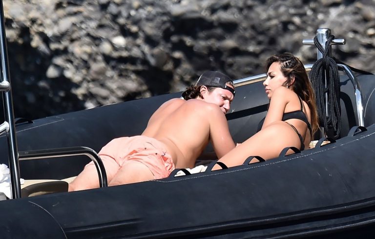 Mădălina Diana Ghenea Bikini Pictures Madalina Diana Ghenea sexy ass and cleavage in a thong bikini seen by paparazzi.