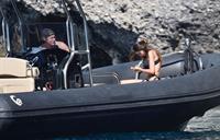 Madalina Diana Ghenea sexy ass and cleavage in a thong bikini seen by paparazzi.


