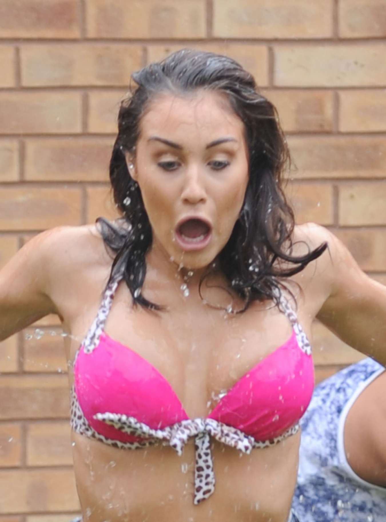 Chloe Goodman gets water dumped on her
