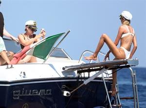 Kristen Stewart and Stella Maxwell sexy lesbians making out on a boat in bikinis seen by paparazzi.










