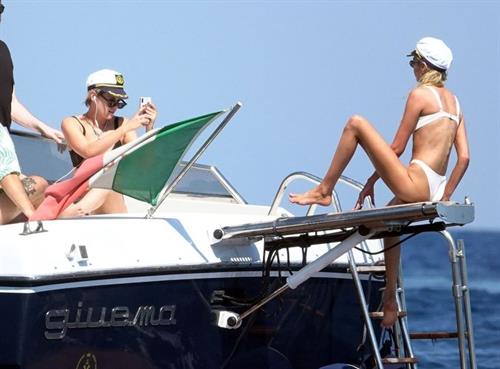 Kristen Stewart Bikini Pictures Kristen Stewart and Stella Maxwell sexy lesbians making out on a boat in bikinis seen by paparazzi.