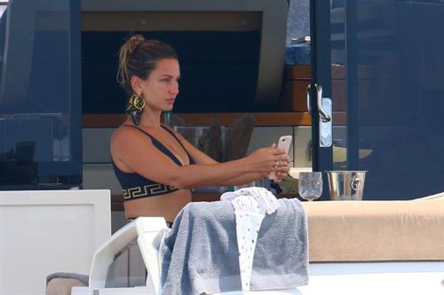 Sam Faiers Bikini Pictures Sam Faiers sexy in a black versace bikini seen by paparazzi showing nice cleavage.