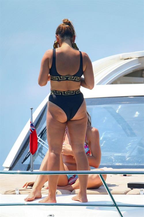 Sam Faiers Bikini Pictures Sam Faiers sexy in a black versace bikini seen by paparazzi showing nice cleavage.
