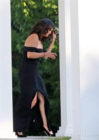 Selena Gomez sexy in a black dress for her cousins wedding showing nice cleavage seen by paparazzi.























