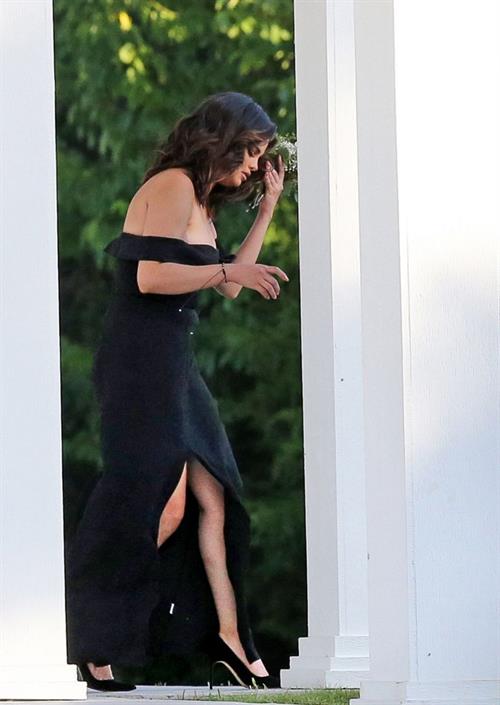 Selena Gomez sexy in a black dress for her cousins wedding showing nice cleavage seen by paparazzi.























