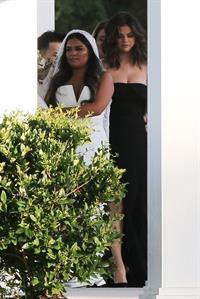 Selena Gomez sexy in a black dress for her cousins wedding showing nice cleavage seen by paparazzi.























