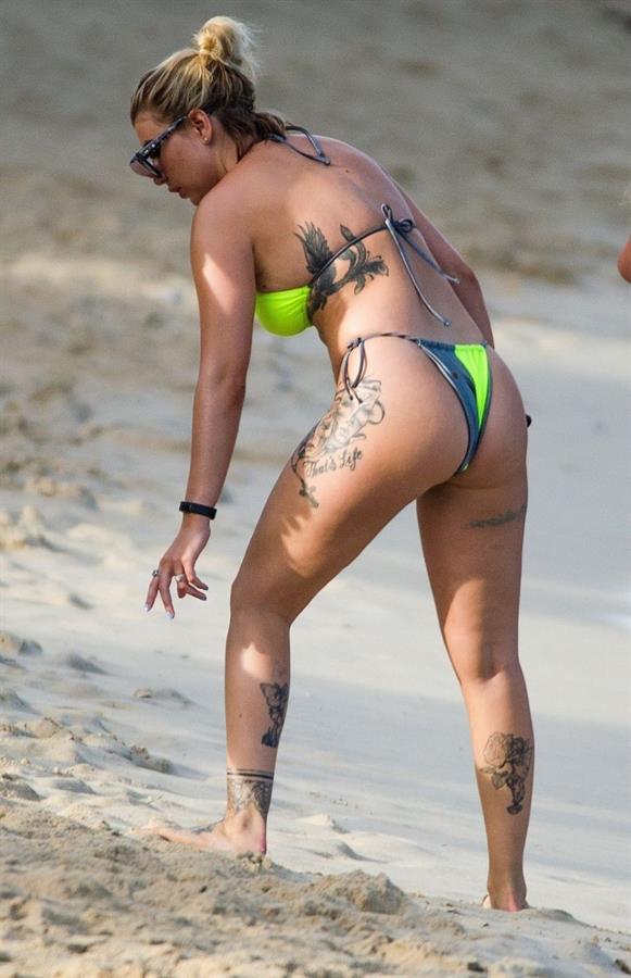 Olivia Buckland sexy in a bikini at the beach seen by paparazzi showing nice cleavage.



