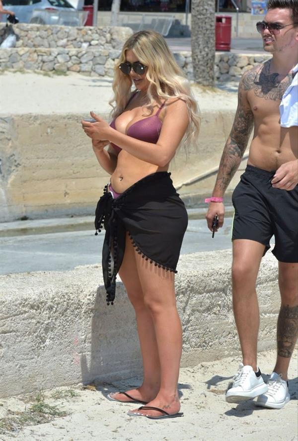 Chloe Ferry big boobs showing nice cleavage seen by paparazzi in a sexy bikini.








