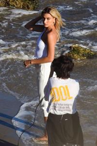 Hailey Bieber braless nipples pokies in a white top at the beach seen by paparazzi during a photo shoot.



















