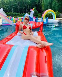 Miley Cyrus sexy in a red bikini in the pool.






























