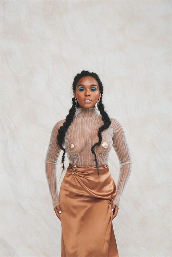 Janelle Monáe braless boobs in a see through top with pasties on her big tits.




































