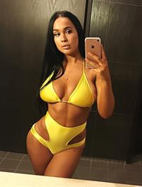 Sarah MacDonald in a bikini taking a selfie