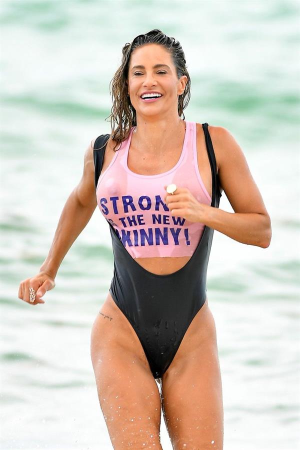 Jennifer Nicole Lee sexy big boobs in a wet see through swimsuit seen by paparazzi at the beach.
