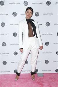 Priyanka Chopra braless boobs in a see through top showing some nice cleavage at Beautycon.

