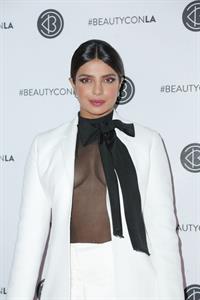 Priyanka Chopra braless boobs in a see through top showing some nice cleavage at Beautycon.

