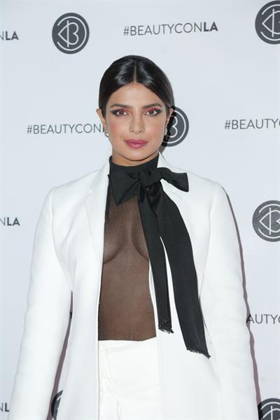 Priyanka Chopra braless boobs in a see through top showing some nice cleavage at Beautycon.

