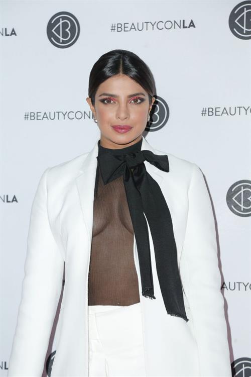 Priyanka Chopra braless boobs in a see through top showing some nice cleavage at Beautycon.

