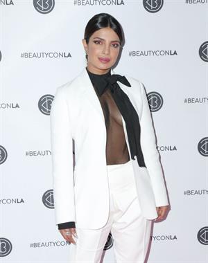 Priyanka Chopra braless boobs in a see through top showing some nice cleavage at Beautycon.

