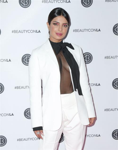 Priyanka Chopra braless boobs in a see through top showing some nice cleavage at Beautycon.

