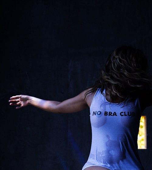 Halle Berry Pictures Halle Berry braless boobs in a see through wet top showing her tits.