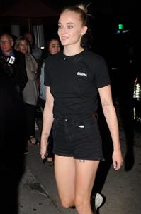 Sophie Turner braless boobs in a black shirt seen by paparazzi showing her tits and her pierced nipple.





