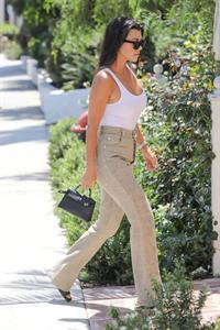 Kourtney Kardashian braless boobs in a see through white top seen by paparazzi showing off her tits.



















