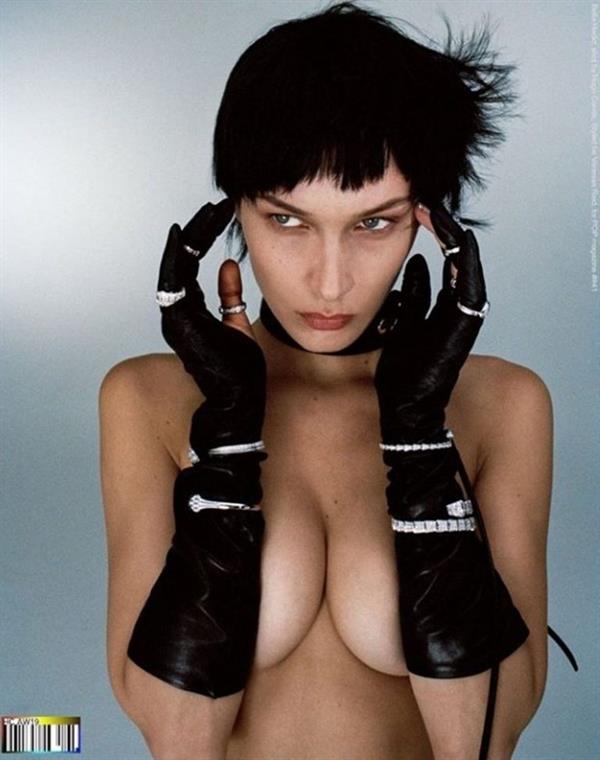 Bella Hadid topless new photo shoot for POP magazine covering her nude boobs with her arms.

