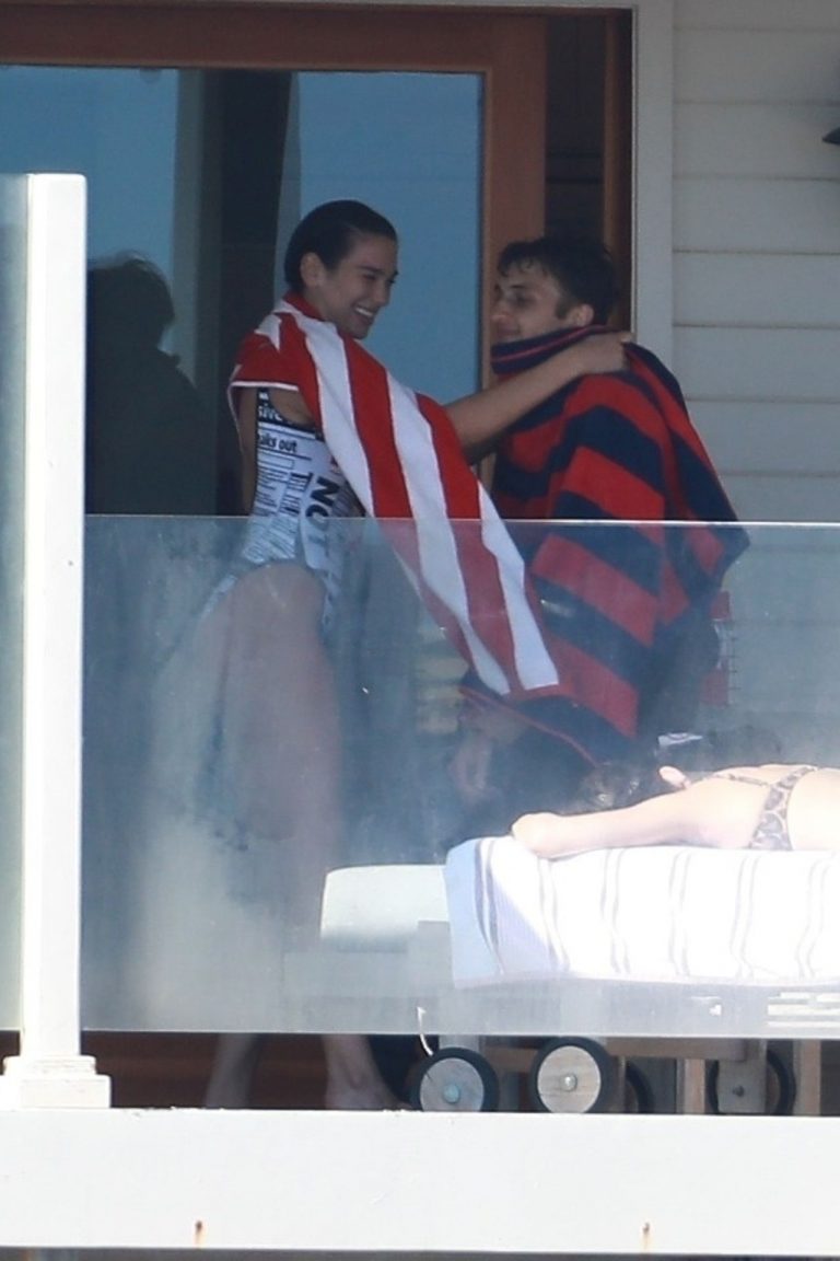 Dua Lipa sexy ass and cleavage in a swimsuit at the beach seen with her boyfriend by paparazzi.













