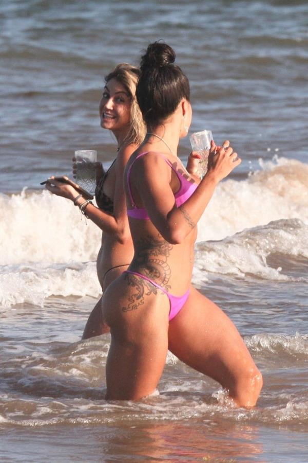 Aline Riscado seen at the beach by paparazzi in a sexy ass thong bikini showing nice cleavage.


