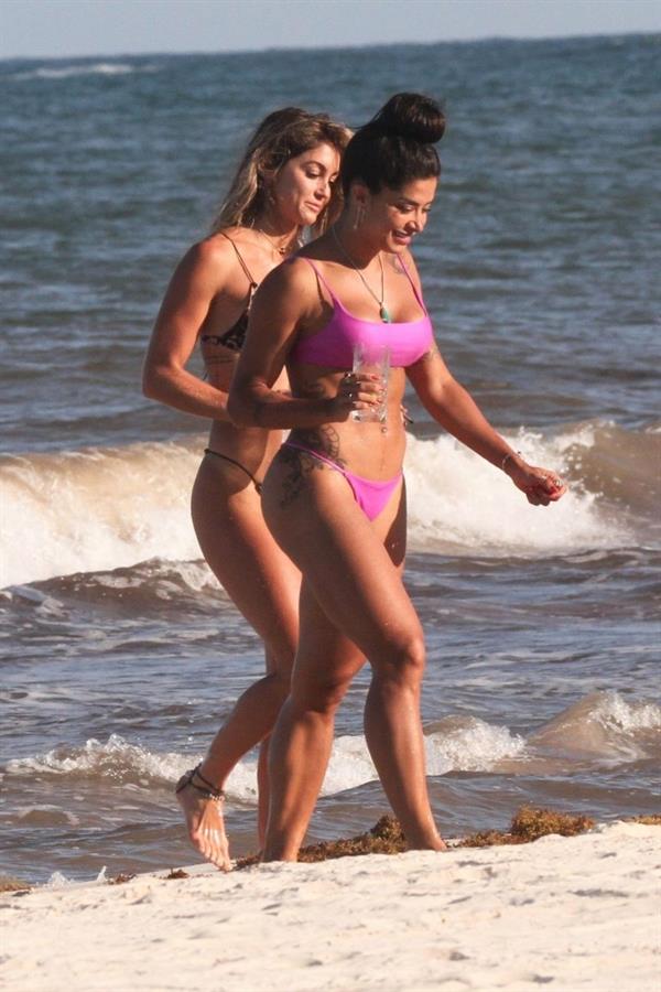 Aline Riscado seen at the beach by paparazzi in a sexy ass thong bikini showing nice cleavage.


