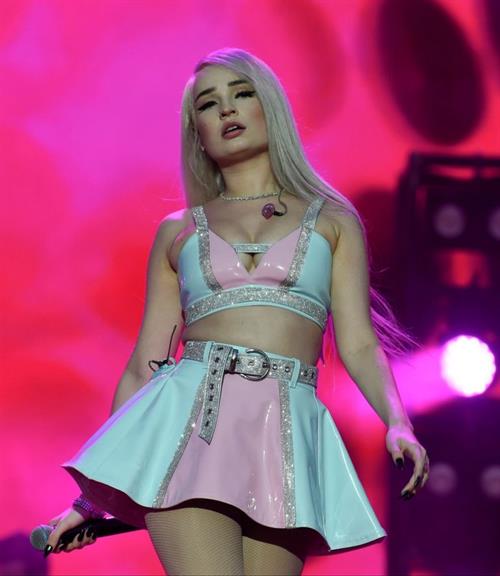Kim Petras Pictures Kim Petras upskirt on stage singing and showing her panties.