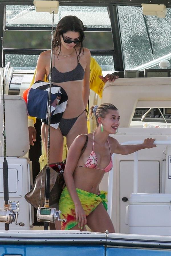 Hailey Bieber, Kendall Jenner and Justine Skye sexy bikini and swimsuit photos seen on a boat drinking for Hailey Bieber's bachelorette party.
