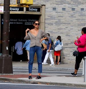 Katie Holmes sexy cleavage seen by paparazzi in a revealing outfit.

