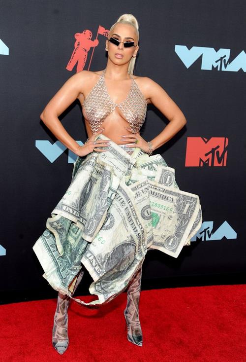 Veronica Vega Pictures Veronica Vega showing off her braless boobs on the red carpet at the MTV VMA's in a see through top.