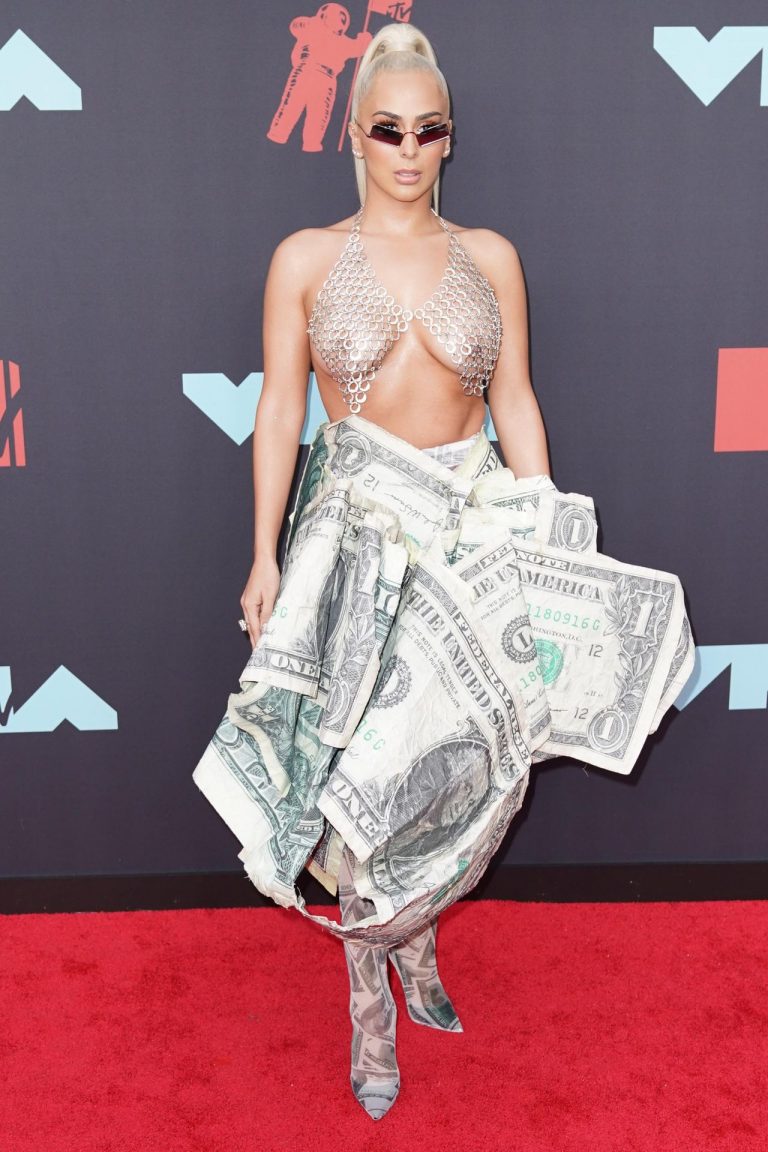 Veronica Vega Pictures Veronica Vega showing off her braless boobs on the red carpet at the MTV VMA's in a see through top.