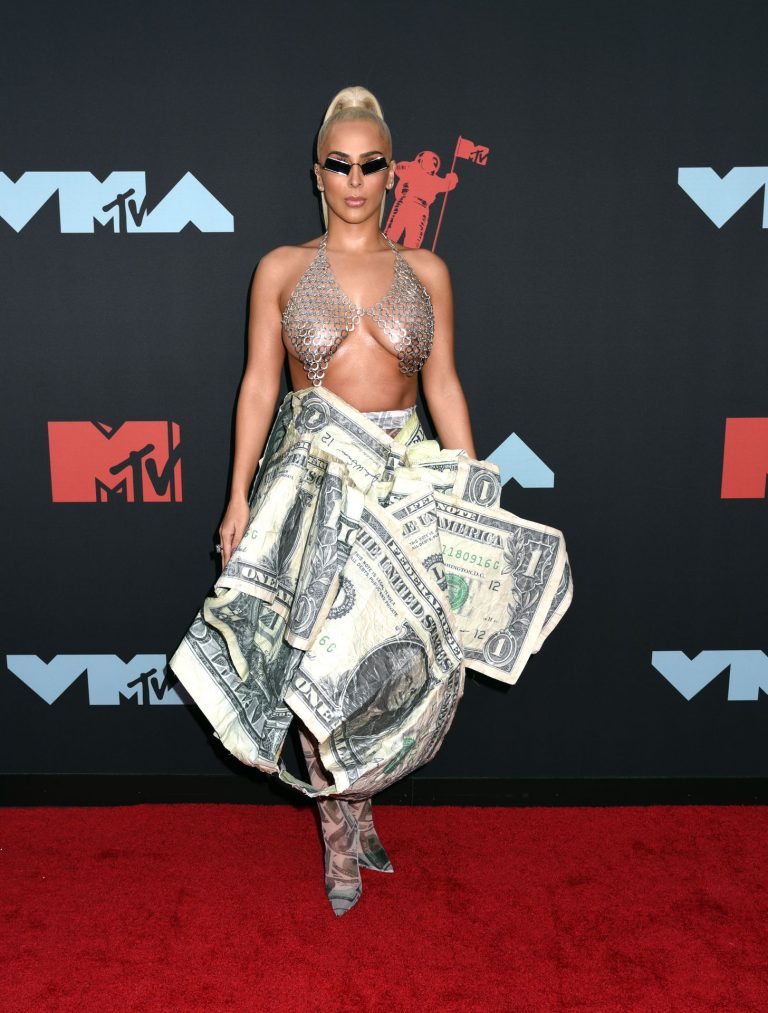 Veronica Vega Pictures Veronica Vega showing off her braless boobs on the red carpet at the MTV VMA's in a see through top.