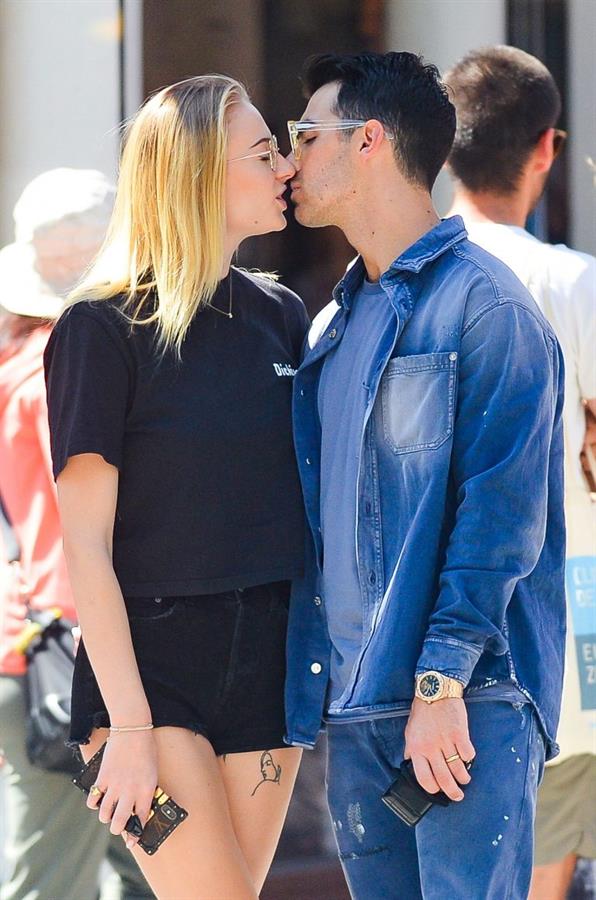 Sophie Turner braless boobs kissing Joe Jonas seen by paparazzi.
















