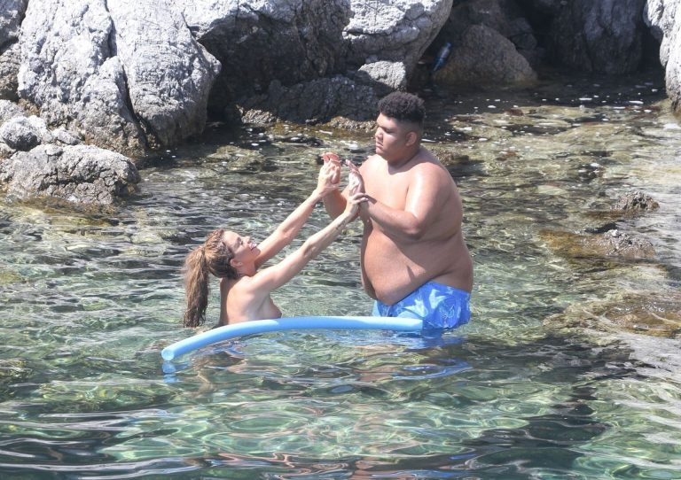 Katie Price Pictures Katie Price caught nude with her son by paparazzi showing her topless boobs.