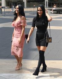 Nikki Bella braless boobs pokies in a black top showing off her tits seen by paparazzi with Brie Bella showing nice cleavage.










