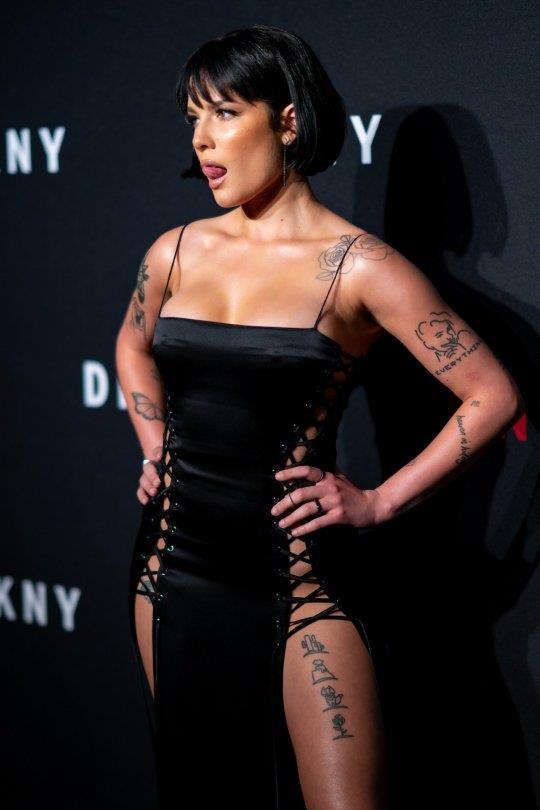 Halsey sexy in a very revealing laced dress seen by paparazzi arriving to DKNY fashion show in New York.






















