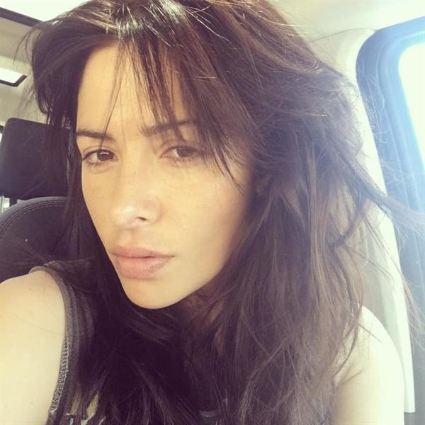 Sarah Shahi taking a selfie