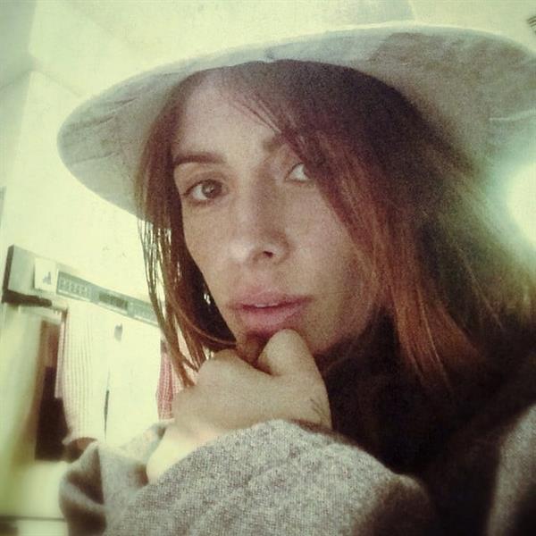 Sarah Shahi taking a selfie