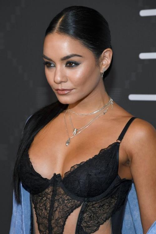 Vanessa Hudgens Pictures Vanessa Hudgens sexy in a lingerie top showing nice cleavage seen by paparazzi showing up to the Savage X Fenty Show.