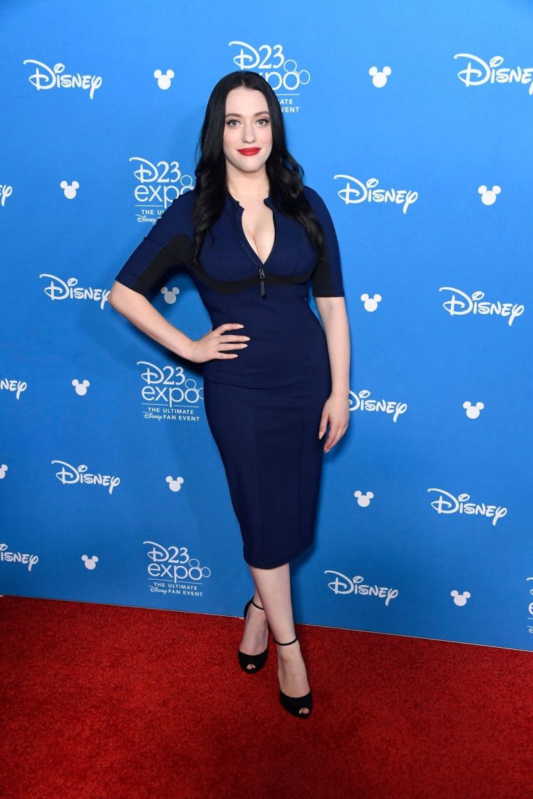 Kat Dennings Pictures Kat Dennings famous big boobs showing nice cleavage in a tight blue dress.