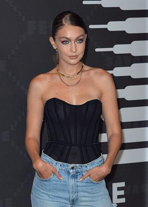 Gigi Hadid braless boobs in a see through top showing off her tits seen by paparazzi with Cara Delevingne and Joan Smalls.













































